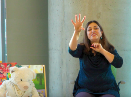 A screenshot from the video Storytime in Farsi with Parvin - There’s a Bear on My Chair! یک خرس روی صندلی من نشسته
