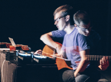 double exposure photo of person playing guitar and using mixing board