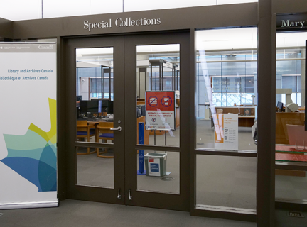 Main Entrance to Special Collections with Library and Archives standing banner