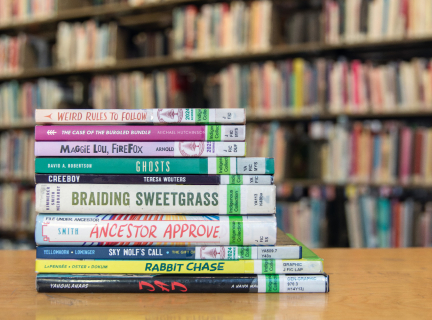 stack of juvenile and young adult indigenous books on a table