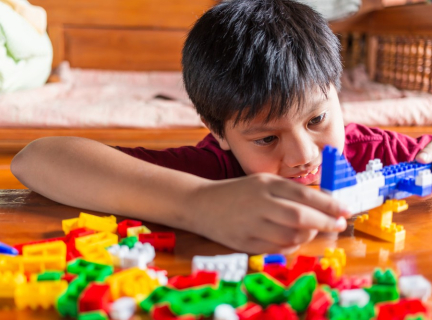 Child playing with LEGO