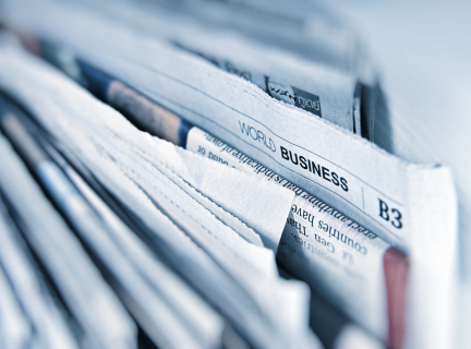 close-up of a stack of paper newspapers