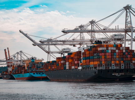 cargo ships docked at the pier during day