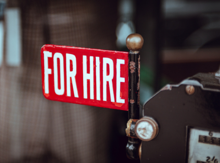 photograph of red and white for hire sign