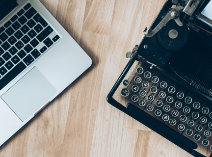 Photo of typewriter and computer