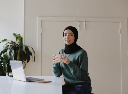 a person using a laptop computer smiling