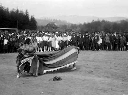 Historical black and white photo of Chinese lion dance, 1921.