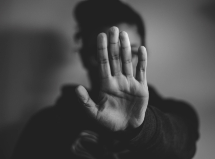 close-up photography of person lifting hands