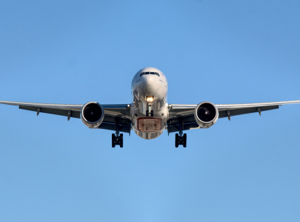 front-facing view of a large commercial airplane in flight