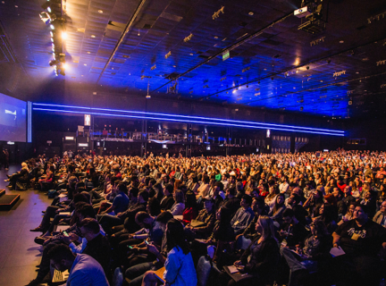 a large number of people attending a conference