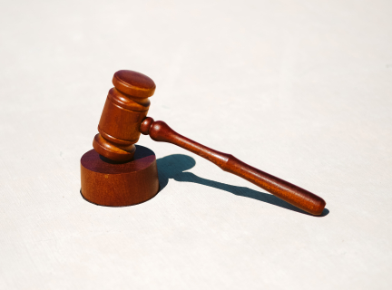 a judge's gavel on a blank background.