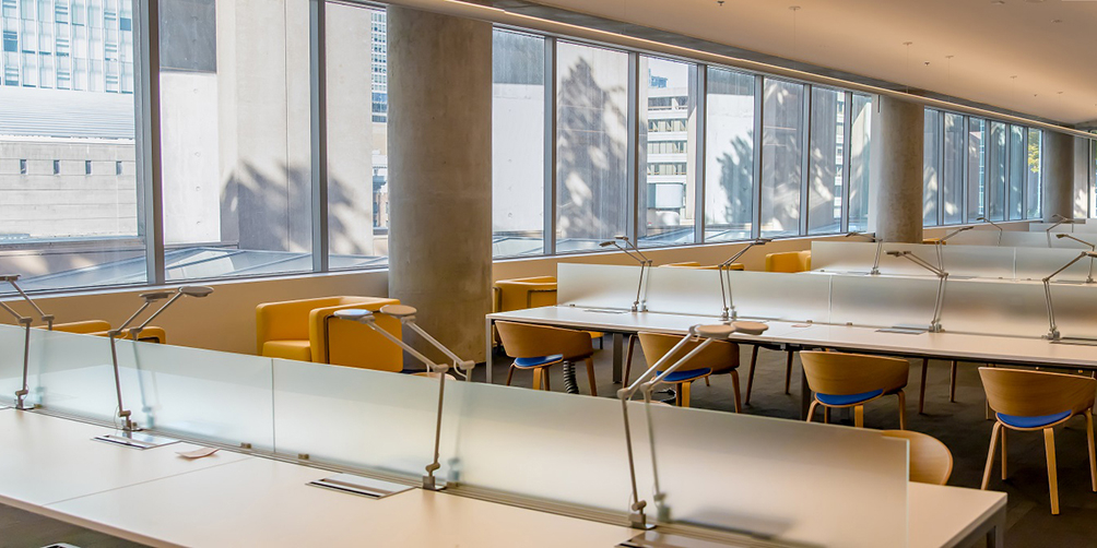 Photo of reading desks and lamps in the Pat Graham Reading Room