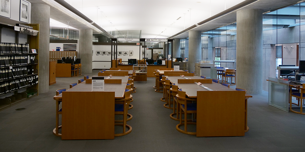 Special Collections study desks in foreground and service desk area in background